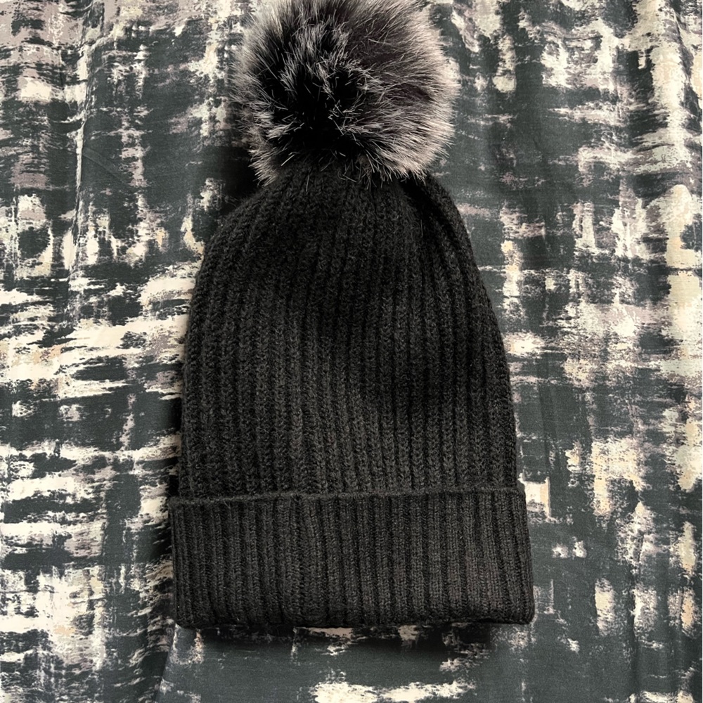Never used black winter pom Pom hat